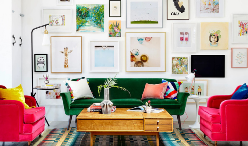 How can hanging art at eye level improve the way a room feels