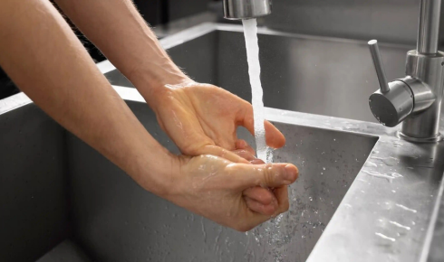 How can installing aerators on taps help save water without feeling a big change