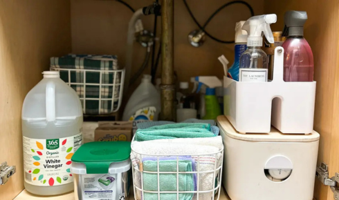 How can keeping a small caddy of supplies make bathroom cleaning faster